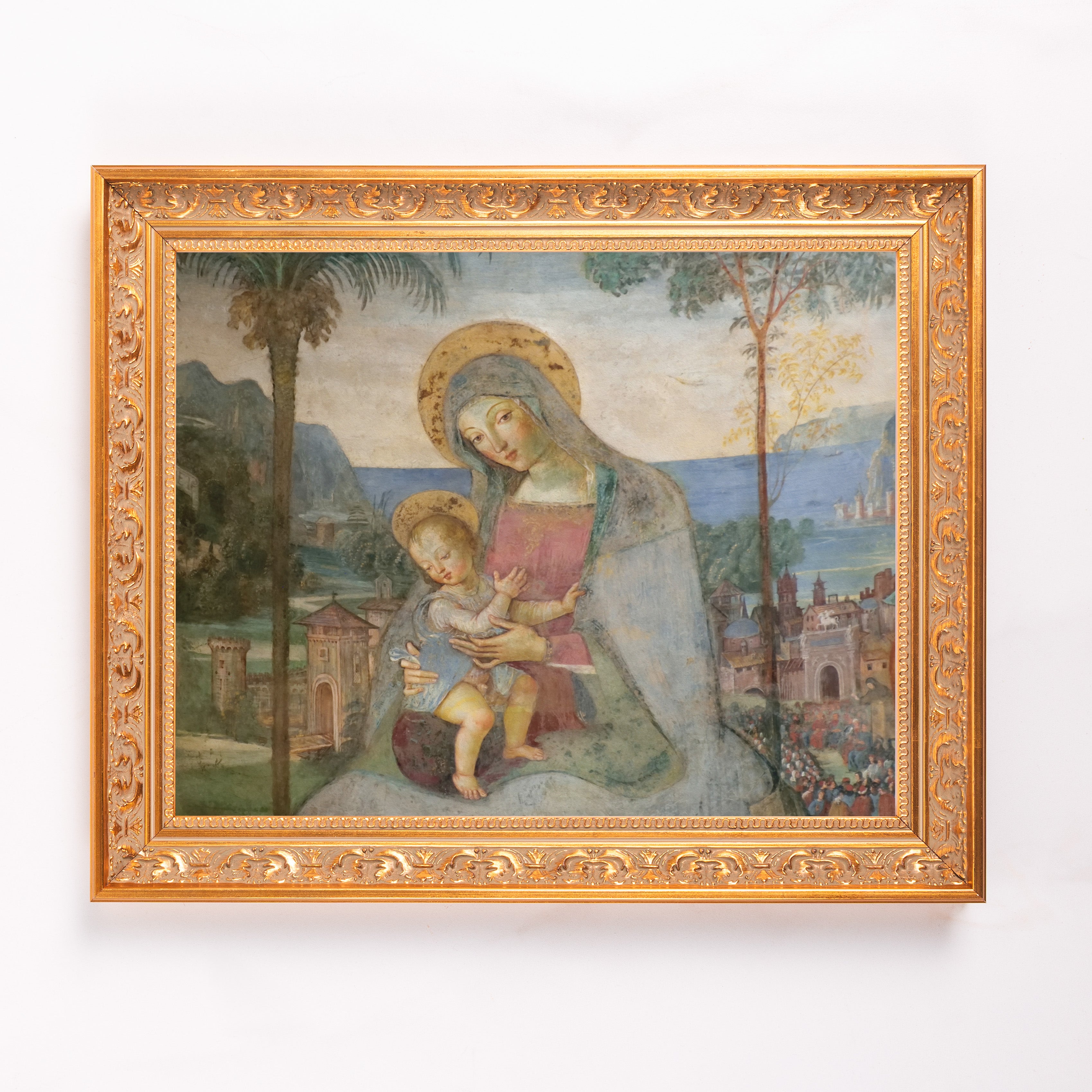 Framed art print depicts the Madonna and Child in muted tones with a detailed gold frame.