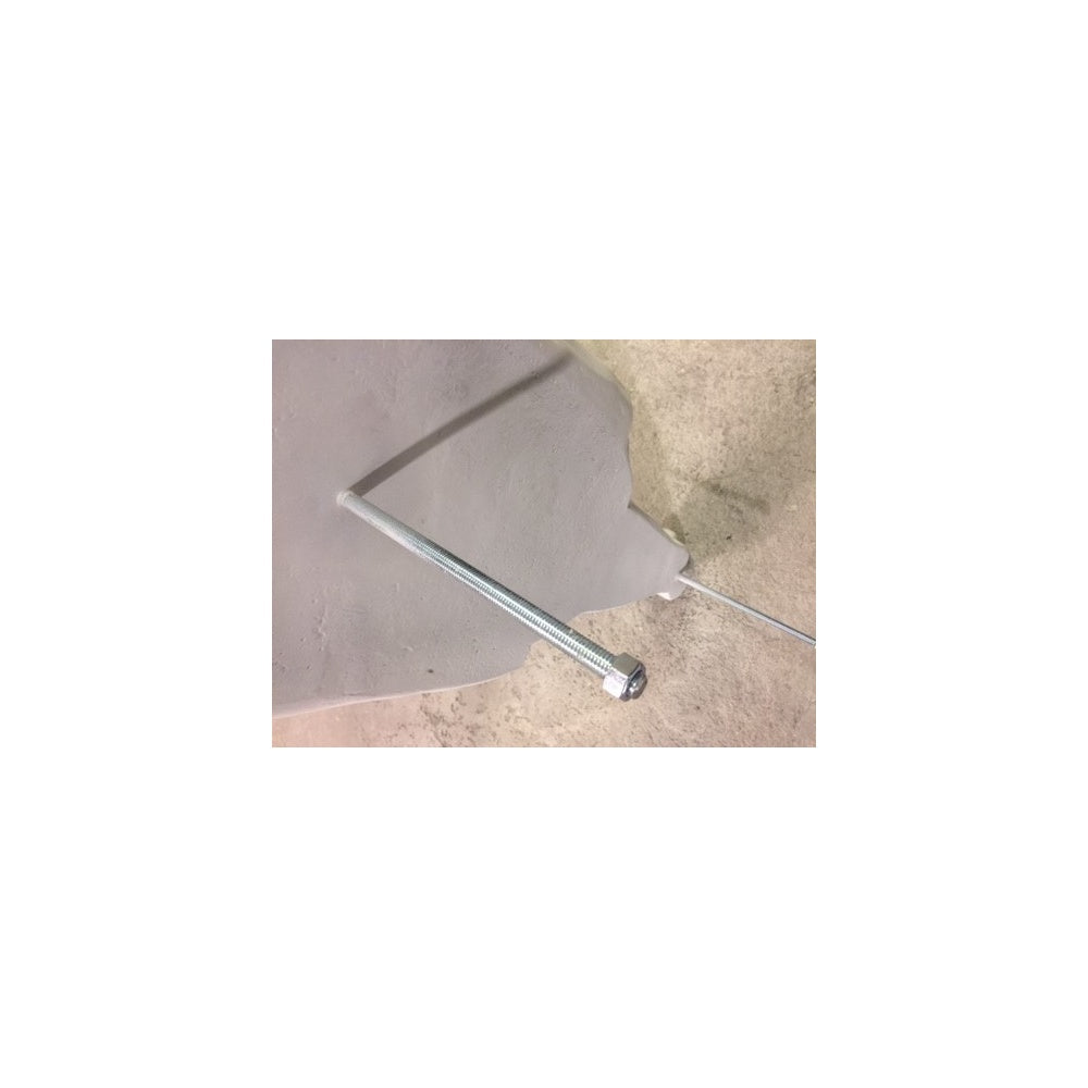 Metal bolt embedded in grey cement, used for anchoring or fastening, with exposed threads and nut, on concrete surface.