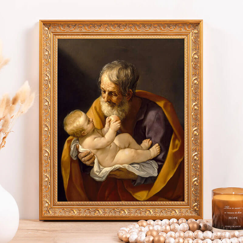 Framed artwork of an elderly man holding a child on a decorative surface with candles.
