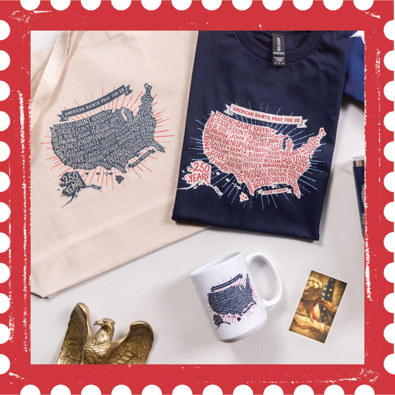 Navy sweatshirt with USA map design, white mug, beige tote bag, and decorative eagle on a white surface.